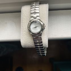 Movado Ladies Silver Watch, White Face .  Hardly Used 