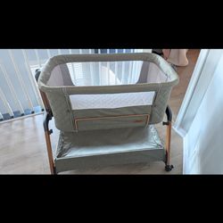 Olive colour jimglo rocking bassinet