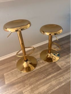 2 gold barstools
