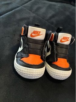 Orange and black Jordan 1s  shoes