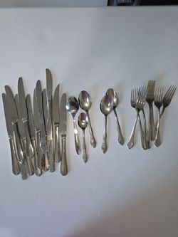 Miscellaneous set of knives, spoons, and forks.