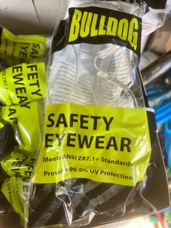 Over 5 boxes with 12 pairs in each box. (Over 56 individual pair of safety glasses)