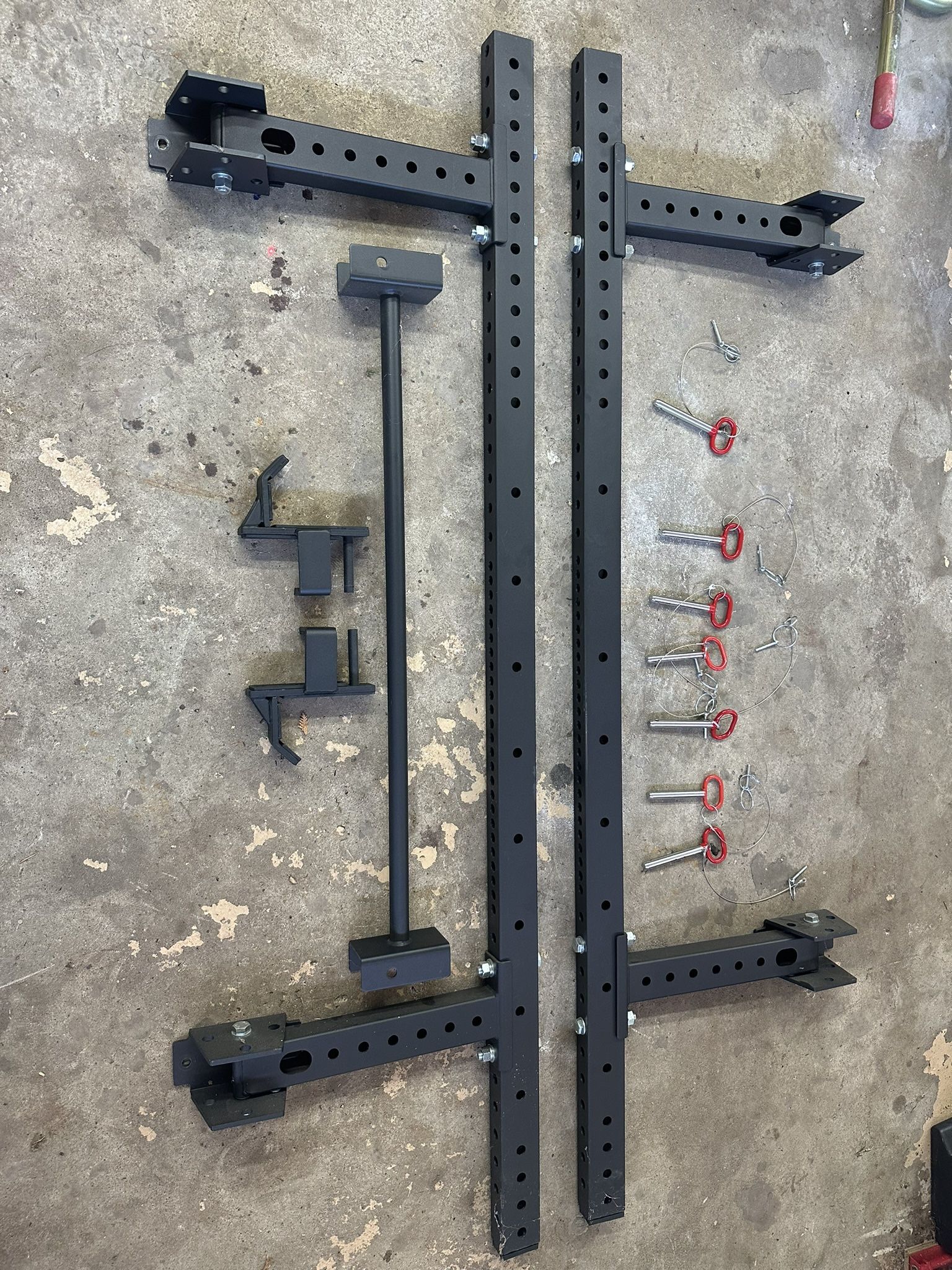 Rogue and Titan power rack, bar, and weight plates - OBO