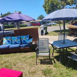 Patio Setup Vintage Style Rattan Couch Two Tables Umbrella Table Four Chairs Umbrella 175 Delivery Available