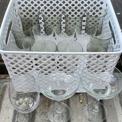 assorted glassware, including tumblers, stemless glasses, and stemmed martini or cocktail glasses,