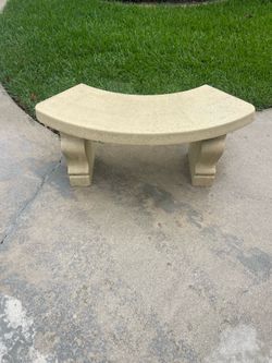 Curved concrete garden bench
