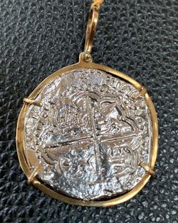 Atocha silver coin pendant in gold bezel