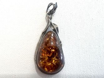 Large teardrop-shaped cognac Baltic amber pendant elegantly set in 925 sterling silver