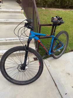 Two bikes ready to ride and helmets