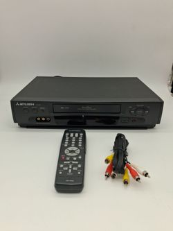 Mitsubishi VHS Hi-Fi VCR with Remote and Cables . Works fine.