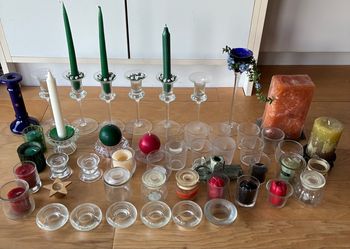 Assortment of glass-metal-stone candle holders and candles. Buy it all for $25.