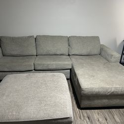 Grey L couch with ottoman that opens up