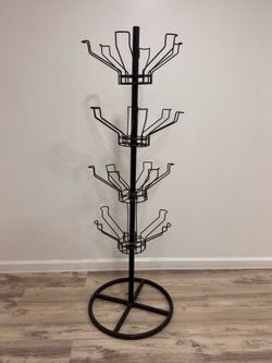 $45 Rotating wire display stand. Floor spinner rack or 4 tier merchandise carousel display.  Designed for retail or home organization. Can be used for