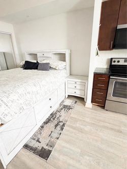 Light Gray Wood Storage Bed with Matching Nightstands