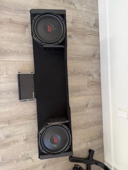 2 twelve inch subs in custom box with kicker amp