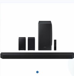 Samsung HW-Q950T 9.1.4-channel Dolby Atmos system, including the soundbar, wireless subwoofer, and two wireless rear speakers.