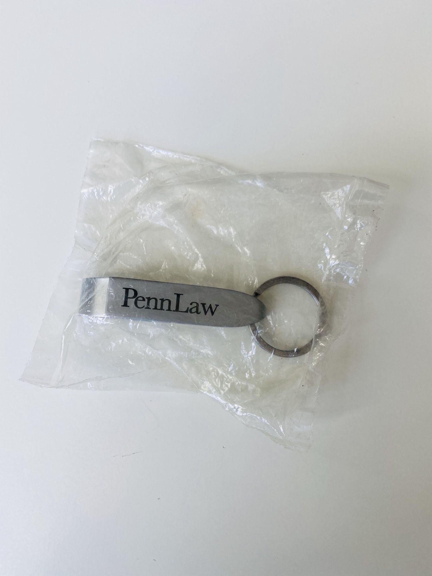 Key Chain-Bottle Opener. University of Pennsylvania Law School logo. High quality metal. Attach it to your keys and you will be always ready to have a