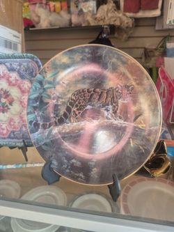 The Clouded Leopard" collector plate from the 1991 W.S. George "World's Most Magnificent Cats" series, featuring artwork by Charles Fracè.
