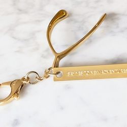 NWOT Anthropologie Lucky Token Gold Wishbone Keychain SAY YES TO ADVENTURE Purse