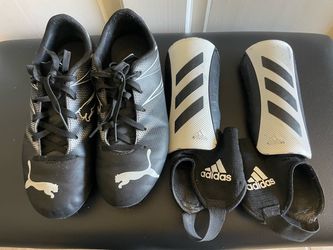 Puma soccer cleats size 4 with free Adidas shin guards