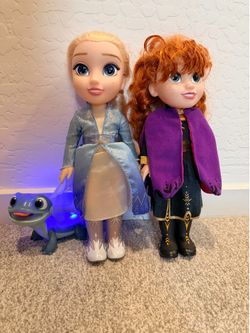 Disney Frozen Anna and Elsa dolls with lizard