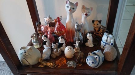 collection of various cat figurines