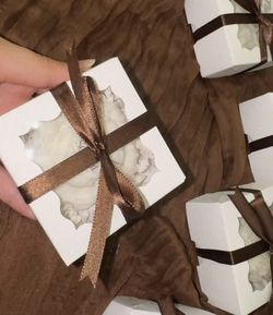 White Gift Boxes with souvenir candle inside fully customized