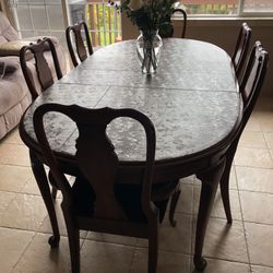 Dining room table with six chairs two leaves and table covers very nice