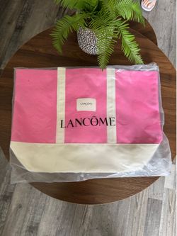 Brand New Pink Lancôme Tote Bag! Brand new Lancôme Paris canvas tote bag — never used! Vibrant hot pink with cream/white bottom and sturdy matching ha