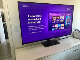 60” flatscreen ROKU TV w/ mounted stand
