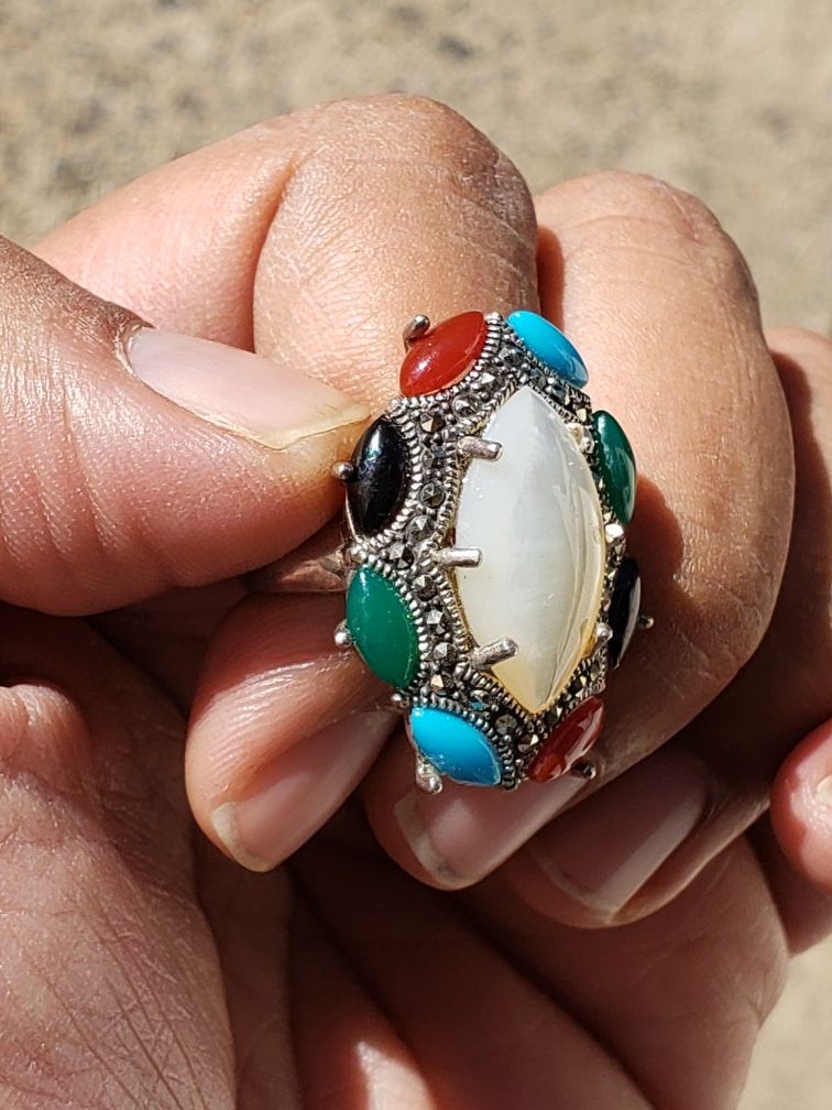 92.5silver ring with several gems stones