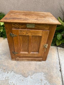 Selling a White Clad wooden ice box , still in solid condition, needs to be refinished