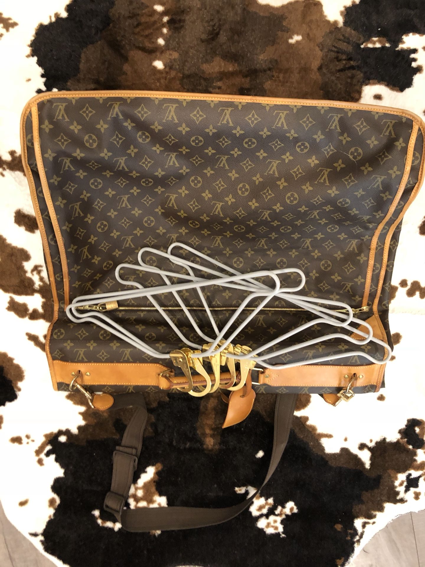 Authentic Louis Vuitton garment bag with authentic Louis Vuitton hangers