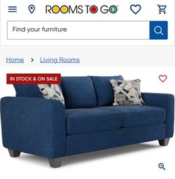 ROOMS TO GO Navy blue couch