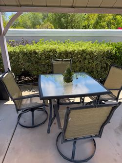 Patio set - 4 chairs and glass table