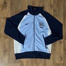 blue and white Nike track jacket