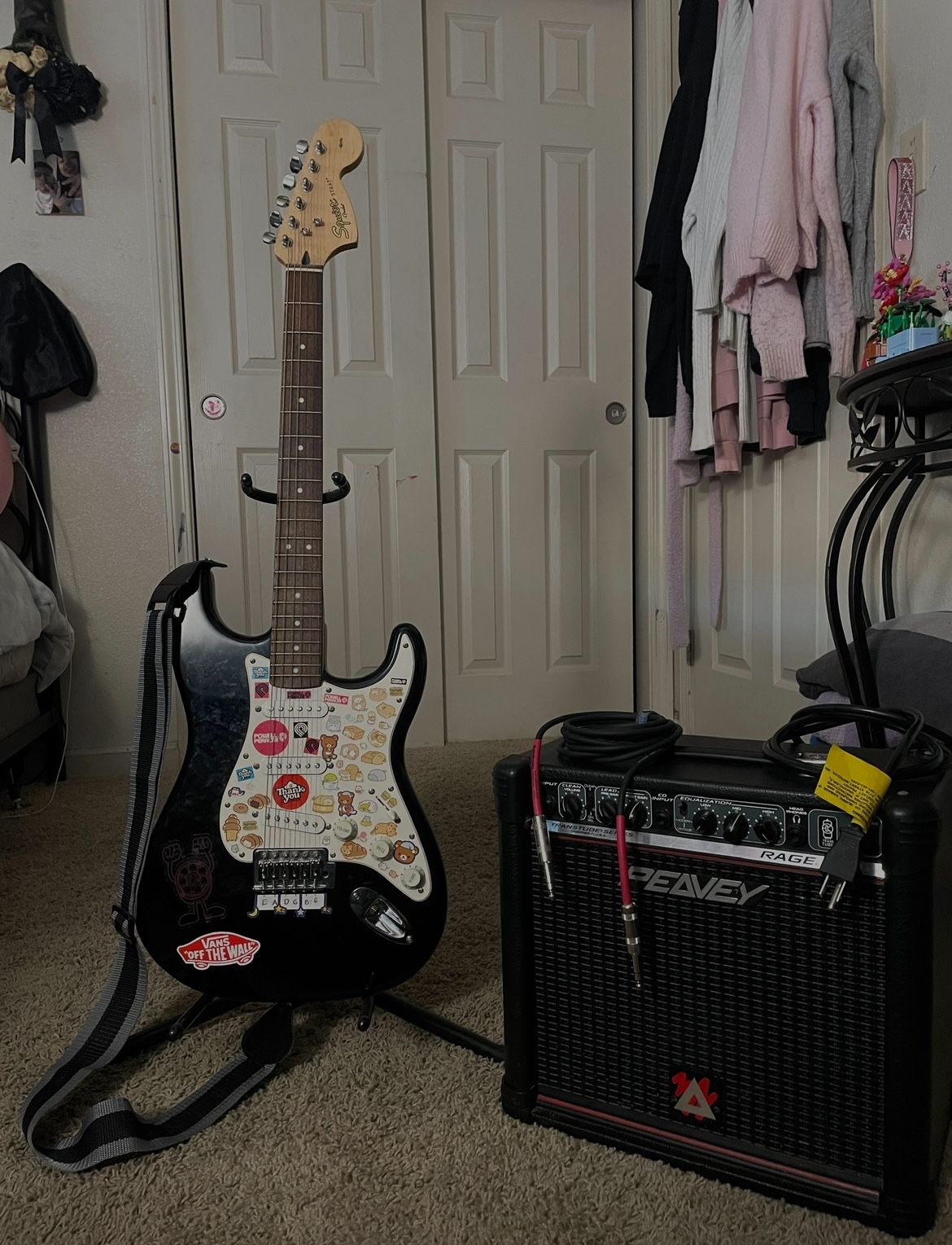 Squier Stratocaster electric guitar with Peavey Rage 158 guitar amplifier