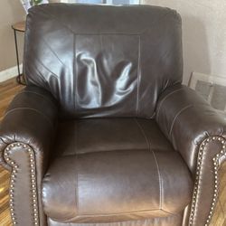 Leather couch, leather recliner, that rocks and reclines