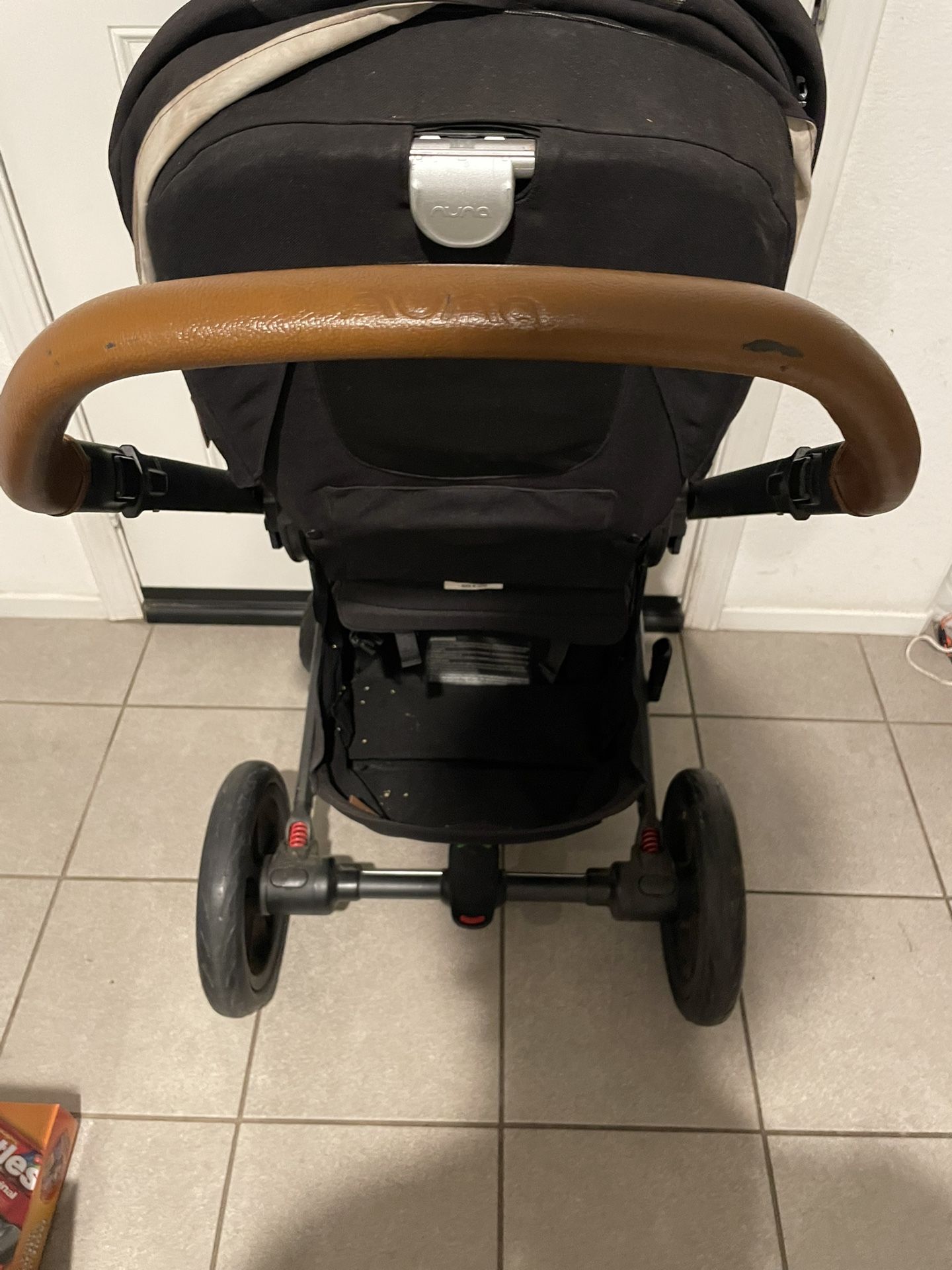 Nuna Compact Baby Stroller – Black with Brown Leather Handle