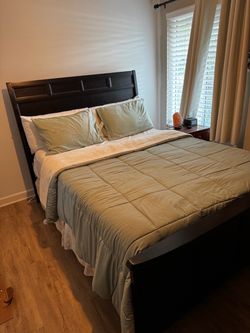 Queen bed frame with box spring and mattress