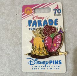 Belle on a float Disney pin parade through the years le