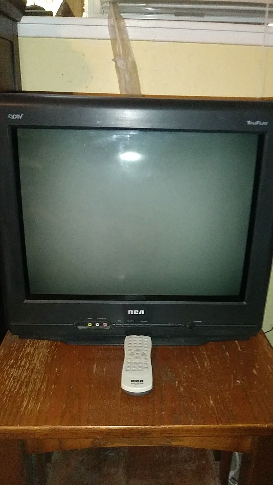 Free. 20 inch diagonal flat screen TV. Works fine,with remote