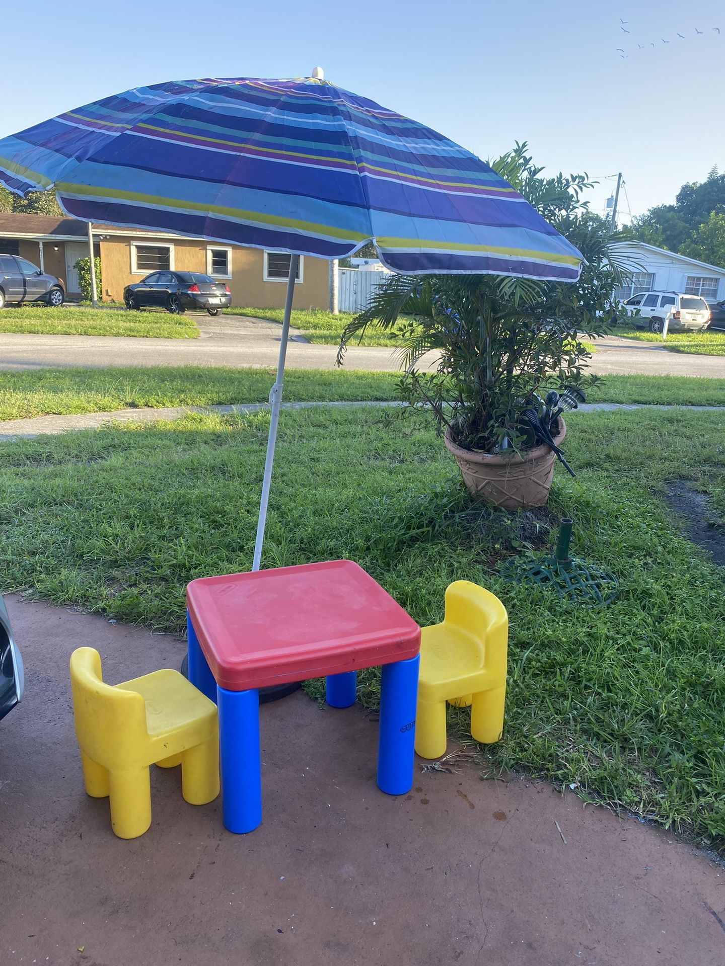 Outdoor Table, 2 Chairs And An Umbrella