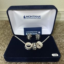 Montana Silversmith: Crystal Shine Jewellery set with 3 ring necklace and 2 earrings.