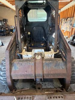 Skid Steer Loader with Bucket Attachment