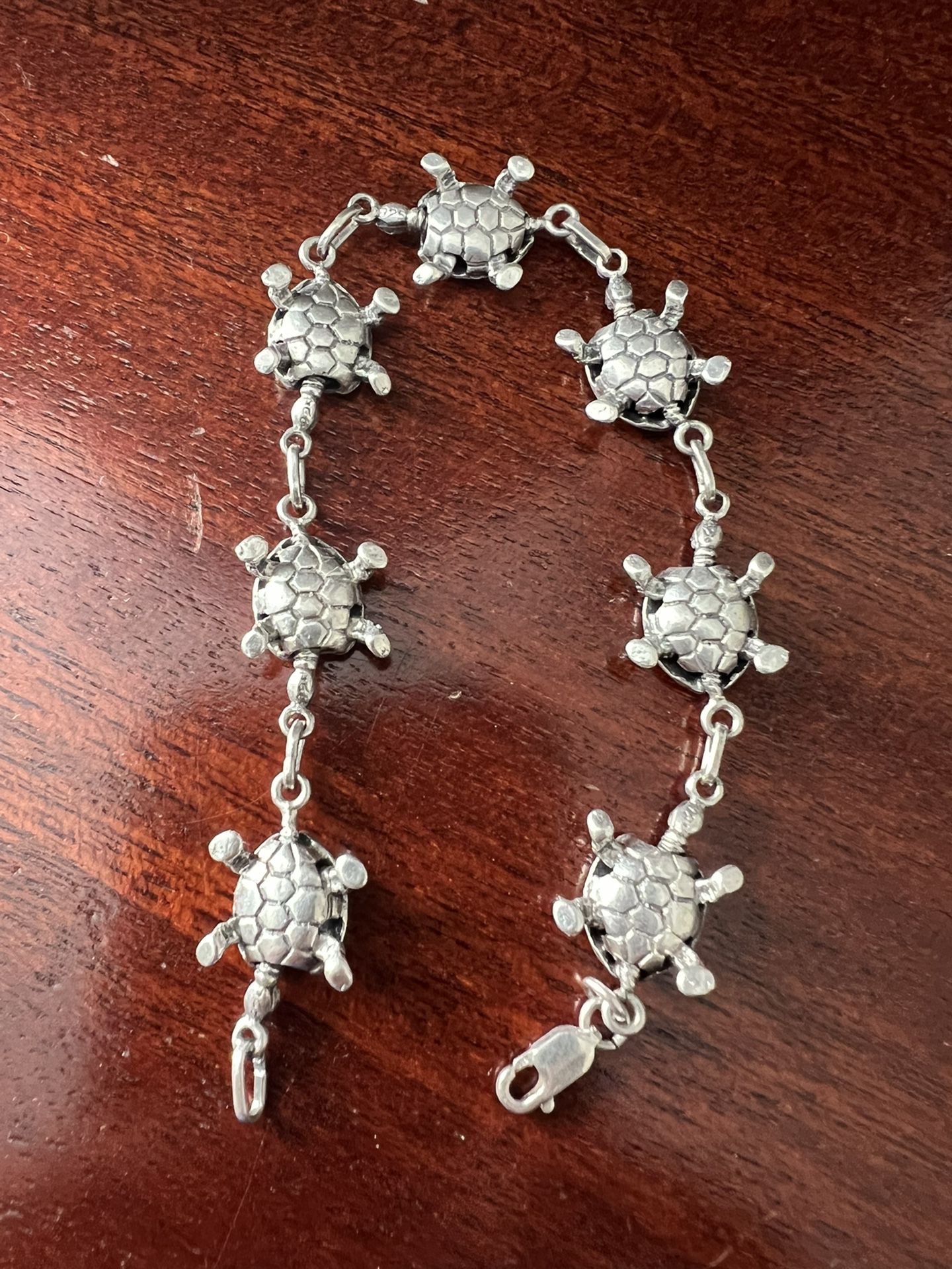 PURE STERLING SILVER 925 BRACELET EVERY SINGLE TURTLE ARE MARKWITH 925 SILVERS SIZE 7.5 IS VERY HEAVY.