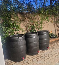 50-GALLON RAIN FLAT BACK BARRELS. - ONLY ONE LEFT.