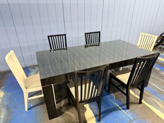 Caracole modern high end dining  table and chairs