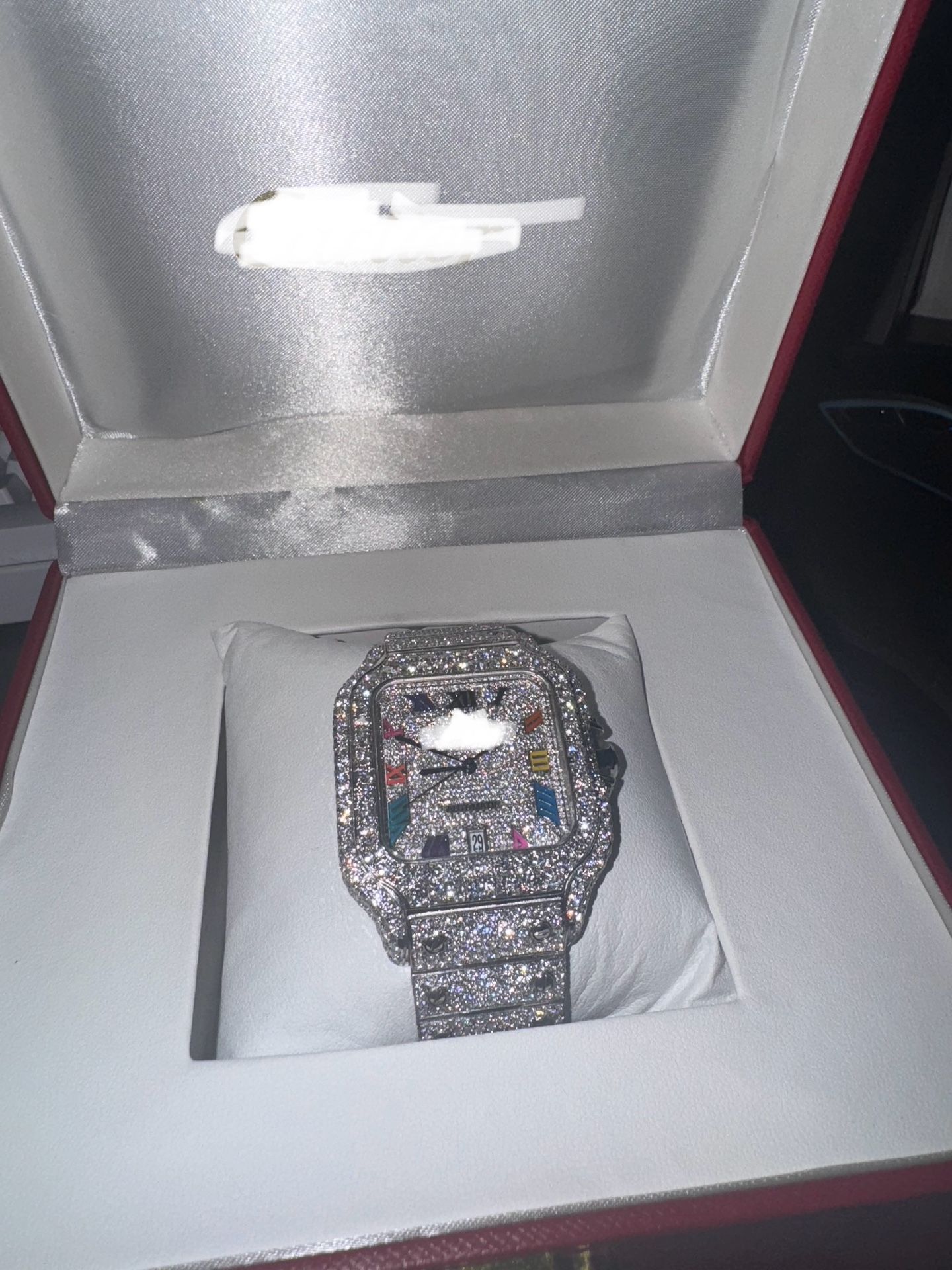 Silver and red Cartier watch