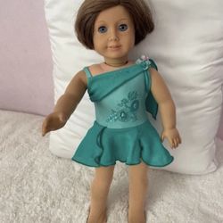 American Girl Doll Wearing Ice-Skating Dress And Tights And Star Shaped Earrings